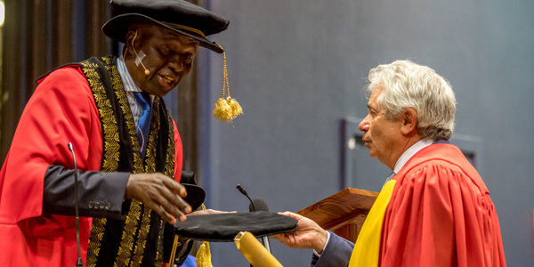 Brian Joffe receives honorary doctorate from Wits Chancellor Justice Dikgang Moseneke.
